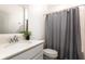 Clean bathroom featuring a tub, vanity, and decorative plant at 4351 Finch Ln, Kissimmee, FL 34746