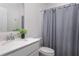 Clean bathroom with a vanity and a combination shower and bathtub, and quartz countertop at 4351 Finch Ln, Kissimmee, FL 34746
