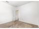 A simple empty bedroom with carpet, an open door and neutral-colored walls at 4351 Finch Ln, Kissimmee, FL 34746
