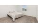 Bedroom with neutral carpet, a bright window, and minimal furnishings at 4351 Finch Ln, Kissimmee, FL 34746