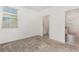 Bedroom with neutral carpet and natural light streaming in from a bright window at 4351 Finch Ln, Kissimmee, FL 34746