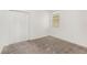 Bedroom featuring neutral carpet, a bright window, and double door closet at 4351 Finch Ln, Kissimmee, FL 34746