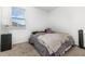 Bedroom with carpet, a bed and a lamp sits beside a window at 4351 Finch Ln, Kissimmee, FL 34746