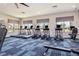 The fitness center features modern exercise equipment and large windows at 4351 Finch Ln, Kissimmee, FL 34746