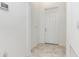 Bright foyer with a white front door and tile flooring at 4351 Finch Ln, Kissimmee, FL 34746