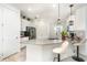 Bright kitchen boasts a breakfast bar, stainless steel appliances and stylish pendant lighting at 4351 Finch Ln, Kissimmee, FL 34746