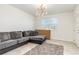 Cozy living room with a comfortable couch and a window view at 4351 Finch Ln, Kissimmee, FL 34746