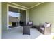 Relaxing outdoor patio area with comfortable wicker furniture, perfect for entertaining or relaxing at 4351 Finch Ln, Kissimmee, FL 34746