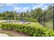 Community playground featuring fun equipment and a safe, fenced area for to enjoy at 4351 Finch Ln, Kissimmee, FL 34746