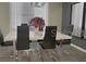 Modern dining room with table, chairs, and stylish decor at 4751 Clock Tower Dr # 103, Kissimmee, FL 34746