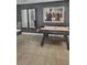 Stylish game room with a pool table and a unique wall art display at 4751 Clock Tower Dr # 103, Kissimmee, FL 34746