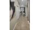 Bright hallway with neutral walls and tiled floors at 4751 Clock Tower Dr # 103, Kissimmee, FL 34746