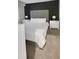 Comfortable bedroom with a large upholstered headboard, carpeted floors and matching nightstands at 4751 Clock Tower Dr # 103, Kissimmee, FL 34746