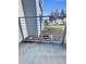 Patio area with landscaping and a railing overlooking manicured lawns at 4751 Clock Tower Dr # 103, Kissimmee, FL 34746