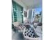 Cozy outdoor patio with comfortable seating, perfect for relaxing at 4751 Clock Tower Dr # 103, Kissimmee, FL 34746