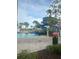 Resort-style swimming pool and water slide providing entertainment and recreation for residents and guests at 4751 Clock Tower Dr # 103, Kissimmee, FL 34746