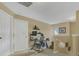 Upstairs hallway features neutral walls, white doors, and carpet flooring to bedrooms at 5056 Gandross Ln, Mount Dora, FL 32757
