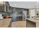 Well-equipped kitchen featuring granite countertops, stainless steel appliances, and dark wood cabinets at 5056 Gandross Ln, Mount Dora, FL 32757