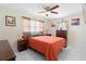 Bright bedroom features a ceiling fan, stylish decor, and ample natural light at 507 Raymond Ave, Frostproof, FL 33843