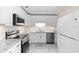 Modern kitchen with stainless steel appliances, granite countertops, and subway tile backsplash at 507 Raymond Ave, Frostproof, FL 33843