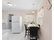 Cozy kitchen table area with ample natural light and modern decor at 507 Raymond Ave, Frostproof, FL 33843