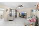 Bright living room with large windows, ceiling fan, and comfortable seating at 507 Raymond Ave, Frostproof, FL 33843