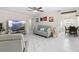 Bright living room showcasing open concept to kitchen with kitchen table at 507 Raymond Ave, Frostproof, FL 33843