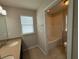 This bathroom features double sinks and a separate tub/shower combo at 5213 Northlawn Way, Orlando, FL 32811