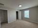 Carpeted bedroom featuring a window, closet, and neutral color scheme at 5213 Northlawn Way, Orlando, FL 32811