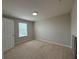 This carpeted bedroom offers comfort and light, perfect for a peaceful retreat at 5213 Northlawn Way, Orlando, FL 32811