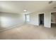 Spacious carpeted bonus room with neutral walls, window, and doorway to additional rooms at 5213 Northlawn Way, Orlando, FL 32811