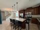 Modern kitchen with granite countertops, stainless steel appliances, and bar seating at 5213 Northlawn Way, Orlando, FL 32811