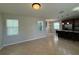 Open-concept kitchen with stainless steel appliances and a large kitchen island at 5213 Northlawn Way, Orlando, FL 32811