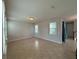 Bright living room with tile flooring and natural light from multiple windows at 5213 Northlawn Way, Orlando, FL 32811