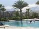 Community pool area with palm trees and lounge chairs, perfect for relaxation at 5213 Northlawn Way, Orlando, FL 32811