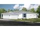 Charming single-story home with a two-car garage, complemented by well-maintained landscaping and blue shutters at 5362 Spoonflower Ct, St Cloud, FL 34771