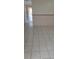 Hallway with bright tile flooring, leading to other areas of the home at 5441 Arpana Dr, Orlando, FL 32839
