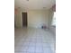 Spacious living room featuring tile floors and natural light, ready for personal touches at 5441 Arpana Dr, Orlando, FL 32839