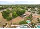 Aerial view of a property with large lot, fenced in yard, a pool, and a screened in pool area at 5606 Eggleston Ave, Orlando, FL 32810