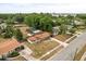 Aerial view of the property in a neighborhood setting, featuring a large lot and screened pool at 5606 Eggleston Ave, Orlando, FL 32810