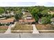Aerial view of property showcasing home, large yard, and screened in pool and patio area at 5606 Eggleston Ave, Orlando, FL 32810