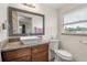 Modern bathroom featuring a vessel sink, granite countertop, and a large mirror at 5606 Eggleston Ave, Orlando, FL 32810