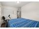 Well-lit bedroom featuring hardwood floors and a large closet at 5606 Eggleston Ave, Orlando, FL 32810
