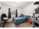 Comfortable bedroom features tile floor, a window and a cozy layout at 5606 Eggleston Ave, Orlando, FL 32810