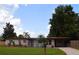 Charming single-story home featuring a well-maintained lawn and inviting curb appeal with mature trees at 5606 Eggleston Ave, Orlando, FL 32810