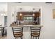 Kitchen with granite countertops, stainless steel appliances and a pass through bar to the dining area at 5606 Eggleston Ave, Orlando, FL 32810