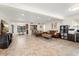 Spacious living area with tile flooring and a view of kitchen bar and dining space at 5606 Eggleston Ave, Orlando, FL 32810