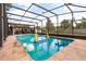 A beautiful screened in pool featuring clear blue water and fun pool toys in a backyard setting at 5606 Eggleston Ave, Orlando, FL 32810