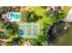 Aerial view of community tennis courts and swimming pool near the lake at 604 Chestnut Oak Cir # 106, Altamonte Springs, FL 32701