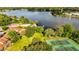 Aerial view of tennis court with lake and lush greenery at 604 Chestnut Oak Cir # 106, Altamonte Springs, FL 32701